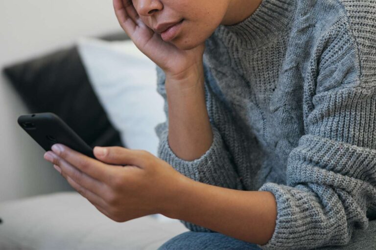 woman-looking-at-phone-042125-88593b64102a46728c9e96ec9fdd2492.jpg