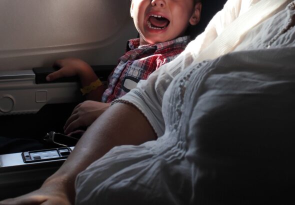 sick-screaming-child-on-a-plane-042825-5d3acc5d8a0b419b962fdce3ad53b5b9.jpg